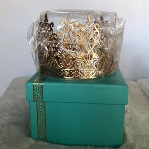 Gold crown cake topper or decoration.